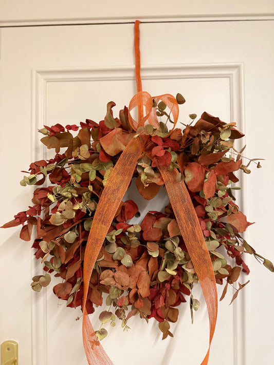 Corona de Navidad en Tonos Naranjas y Rojos