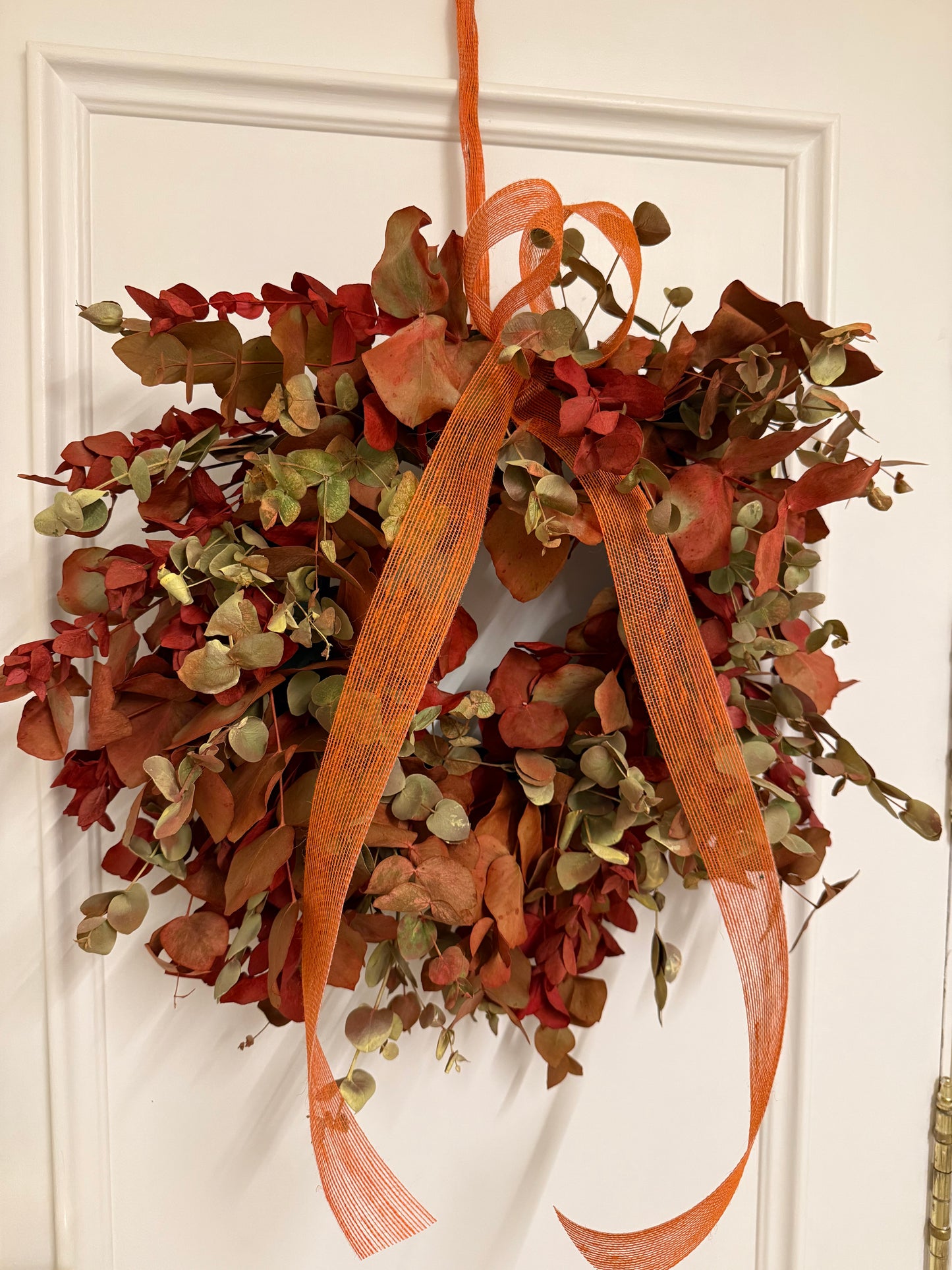 Corona de Navidad en Tonos Naranjas y Rojos